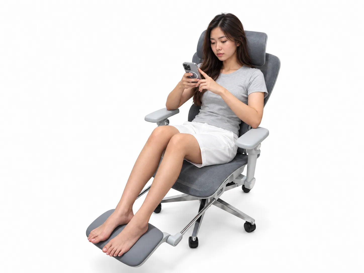 Seated in Atlas with feet resting on the extended footrest